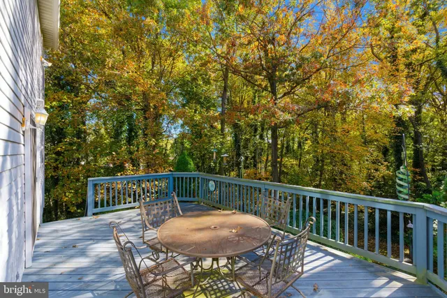a view of a chair and table in the patio