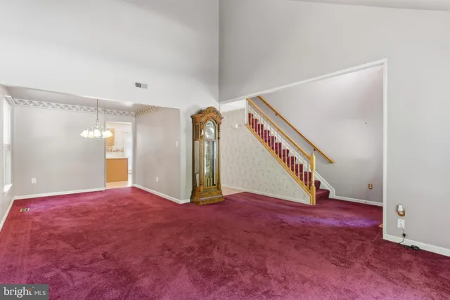 a view of an empty room with stairs