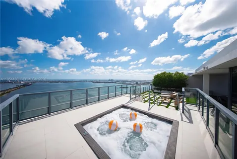 a view of a balcony with wooden floor