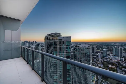 a view of a balcony with furniture