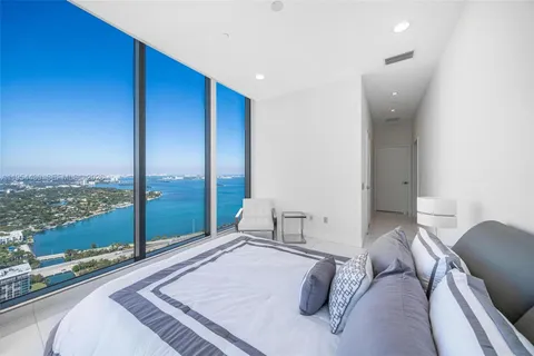 a view of a chairs and table in patio