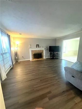 a view of living room with furniture and flat screen tv