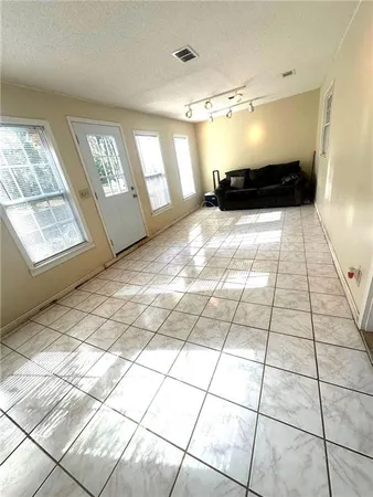 a view of an empty room and window