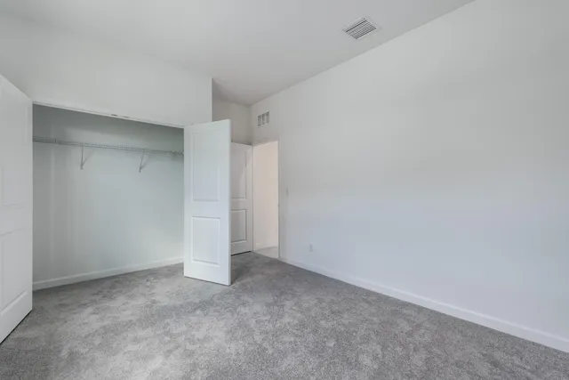 a large kitchen with stainless steel appliances granite countertop a large counter top and a stove top oven