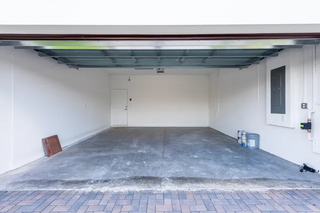 an aerial view of a house with a swimming pool