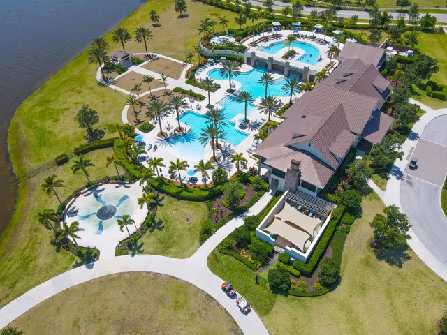 a view of swimming pool with outdoor seating and plants