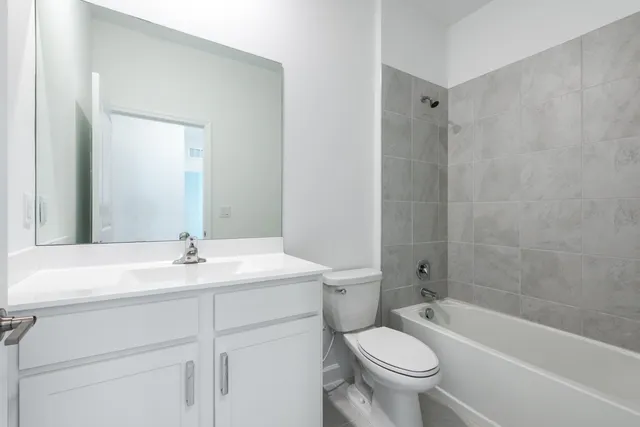 a bathroom with a sink a toilet and a bathtub