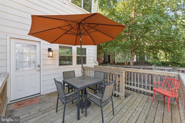 an outdoor space with furniture and umbrella