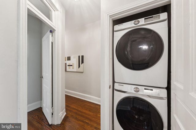 a view of a hallway with washer and dryer