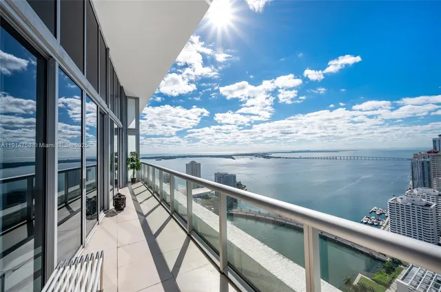 a view of a balcony with wooden floor