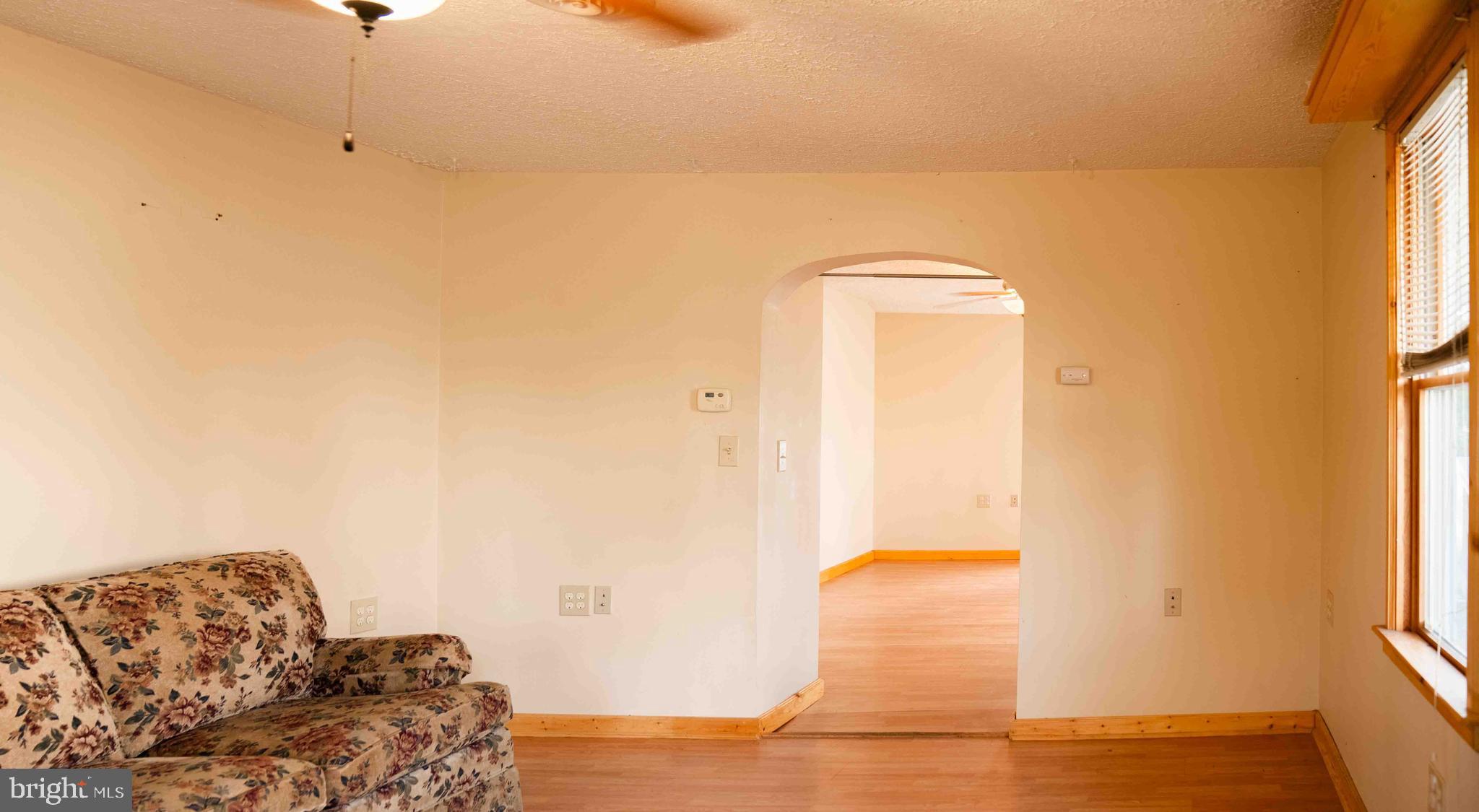 61 Maple Street Cumberland, MD 21502 - Photo 7 of 17 a living room with a couch and a table
