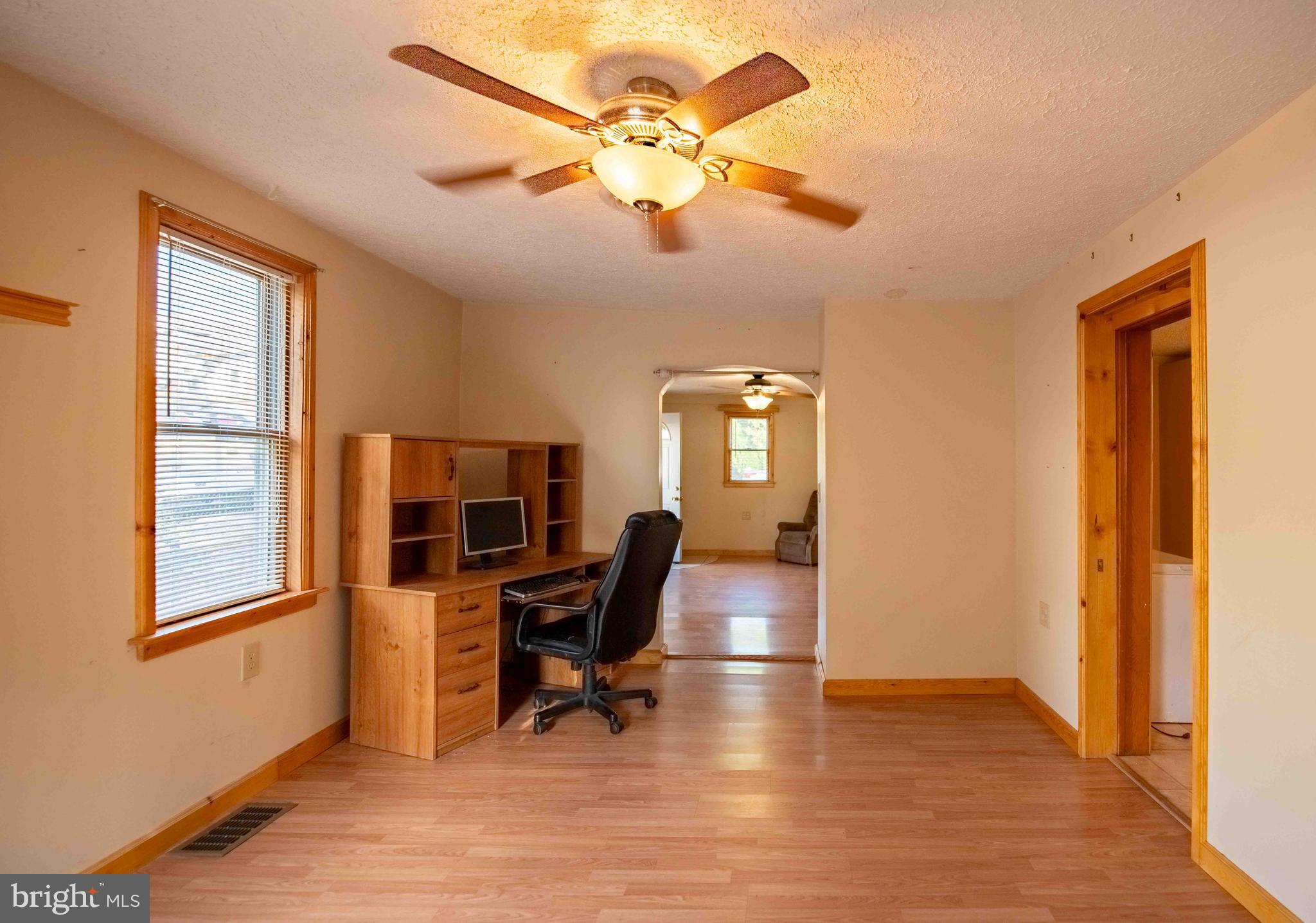 61 Maple Street Cumberland, MD 21502 - Photo 9 of 17 a view of a livingroom with workspace and a window