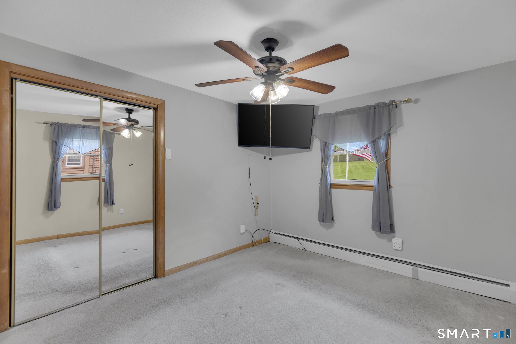 102 Wayne Lane Meriden, CT 06450 - Photo 16 of 36 a view of a livingroom with a chandelier fan and windows