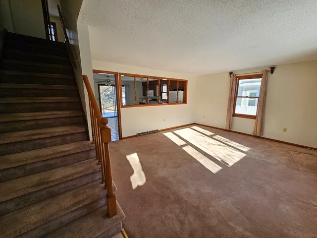 a room with furniture and stairs