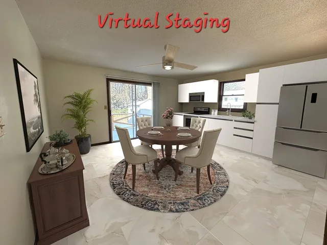 a kitchen with stainless steel appliances granite countertop a refrigerator and a stove top oven