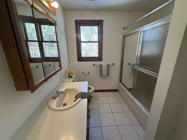 an empty room with a empty space and window