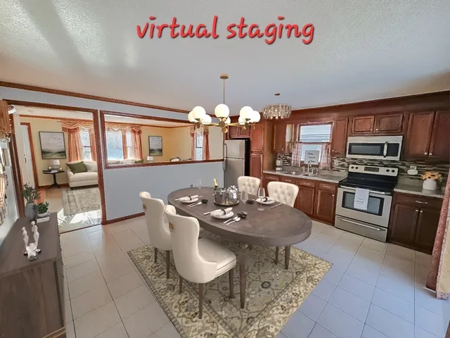 a dining room with furniture and chandelier