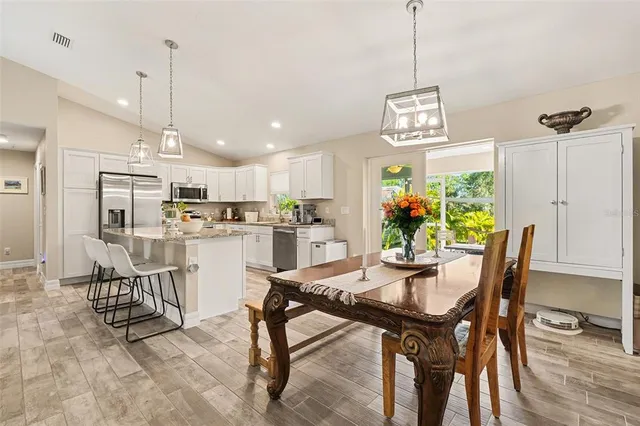 a dining room with furniture and window