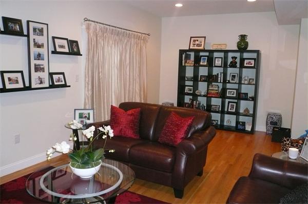 7 C Charles Ridge Road, Unit C Littleton, MA 01460 - Photo 7 of 18 a living room with furniture and a book shelf