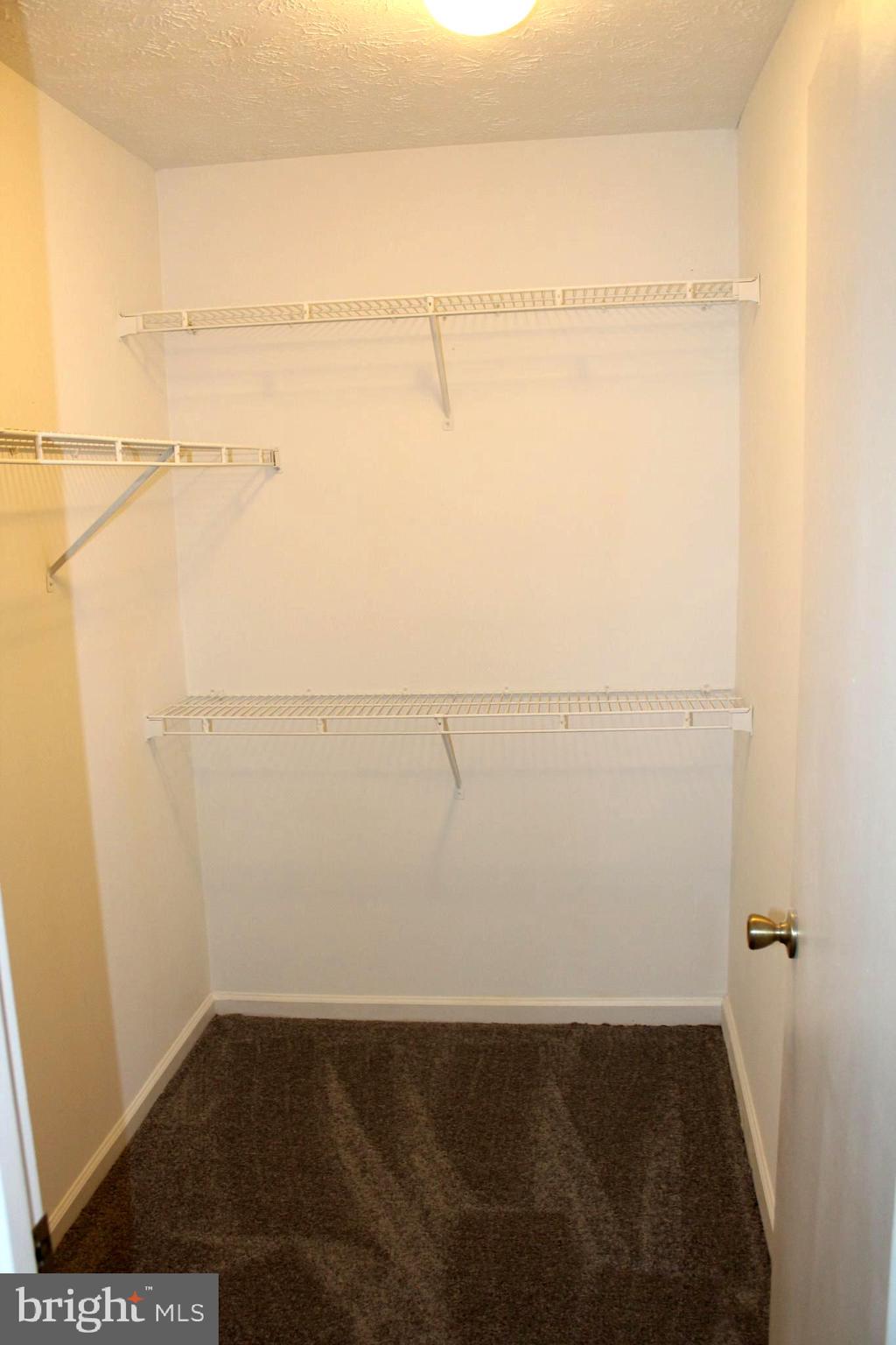 4973 Pintail Court Frederick, MD 21703 - Photo 18 of 28 a view of a room with racks on the wall
