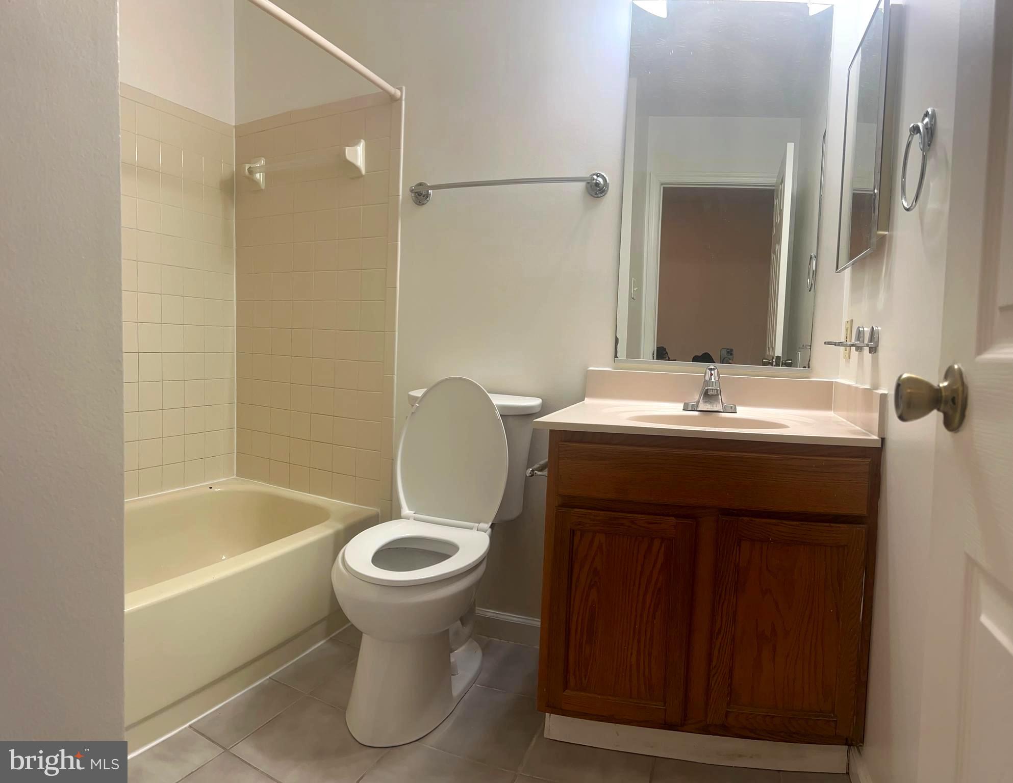4973 Pintail Court Frederick, MD 21703 - Photo 23 of 28 a bathroom with a sink toilet and shower