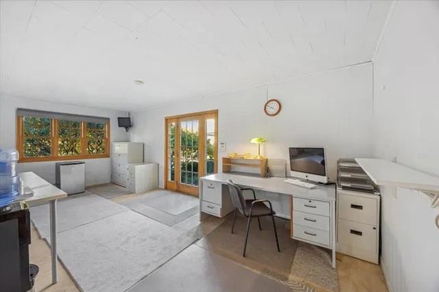 a workspace with furniture and a window