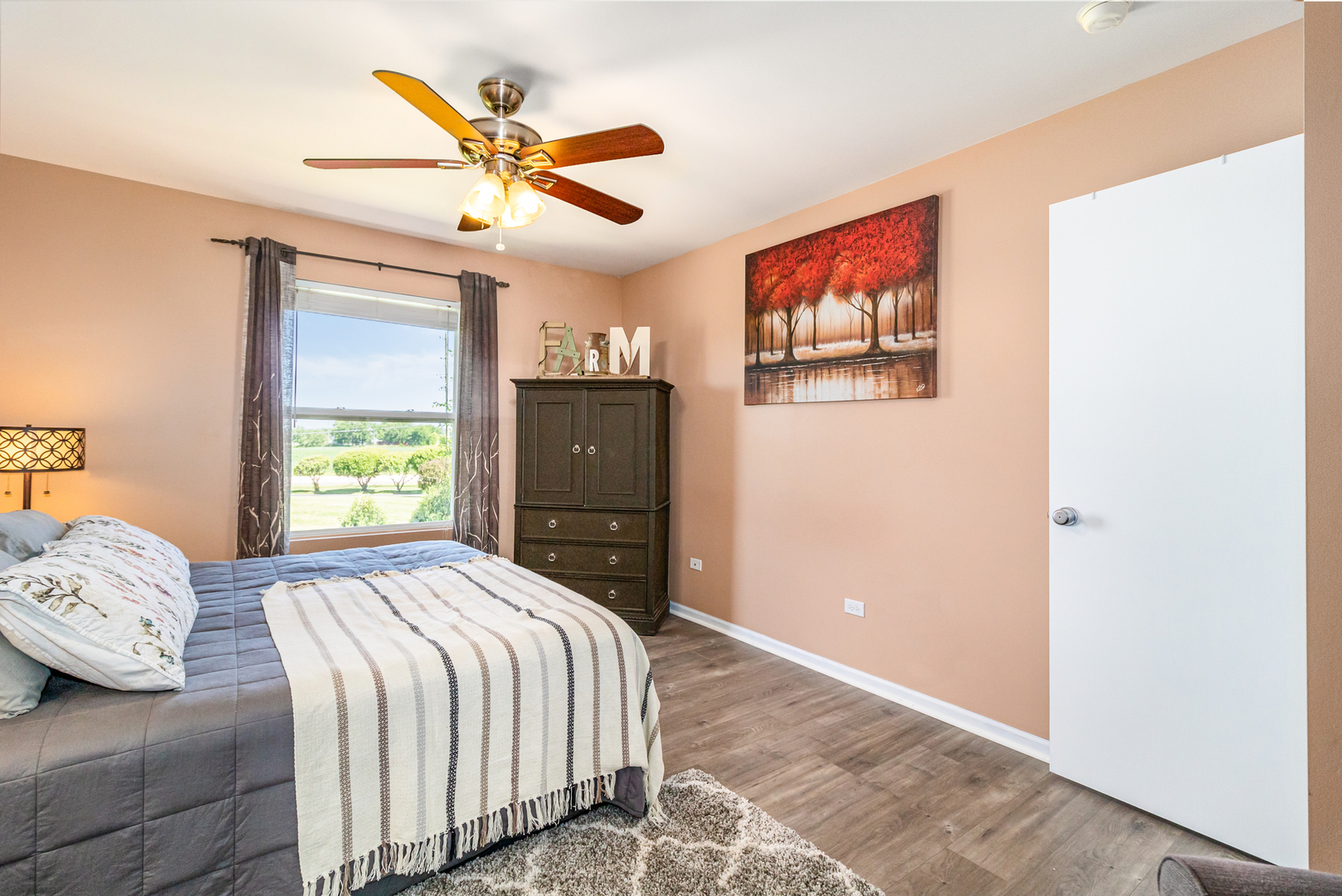 25151 Faraday Road Manhattan, IL 60442 - Photo 7 of 13 a bedroom with a bed and a painting on the wall