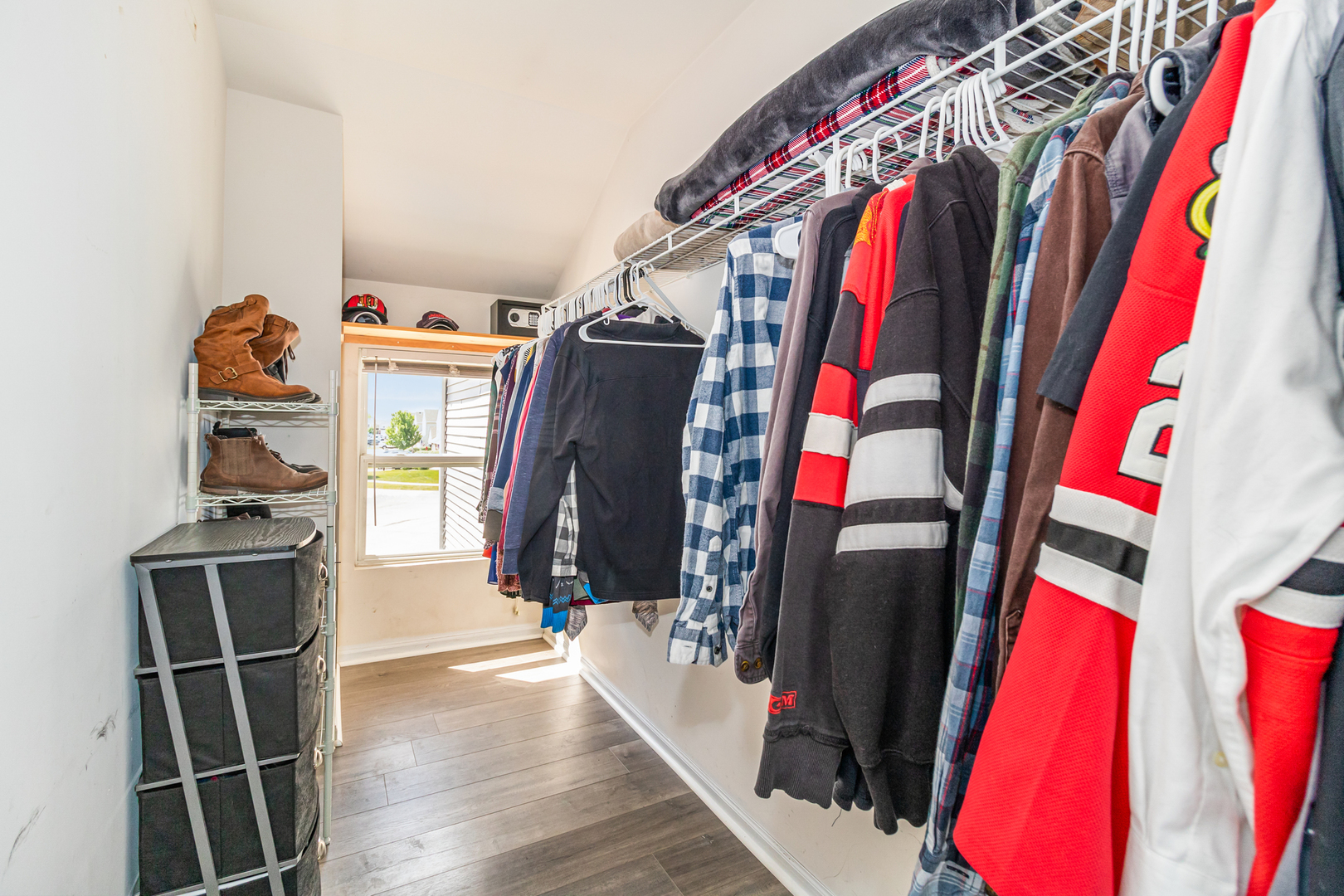 25151 Faraday Road Manhattan, IL 60442 - Photo 8 of 13 a view of walk in closet with clothes and shoes