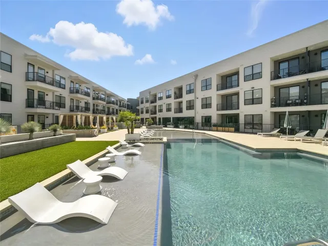 a view of a patio with table and chairs