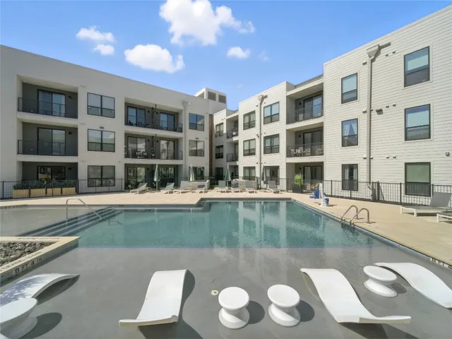 a view of a swimming pool with a lounge chair