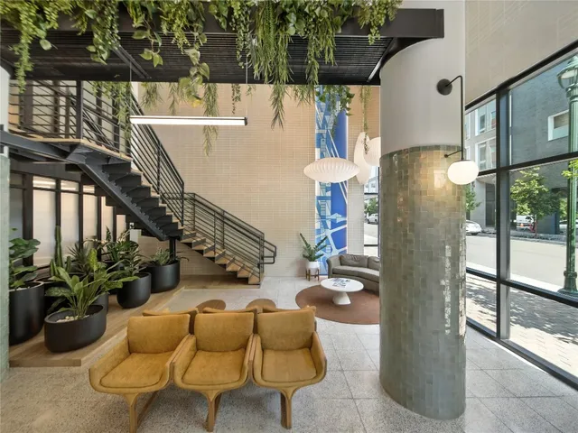 a swimming pool with outdoor seating