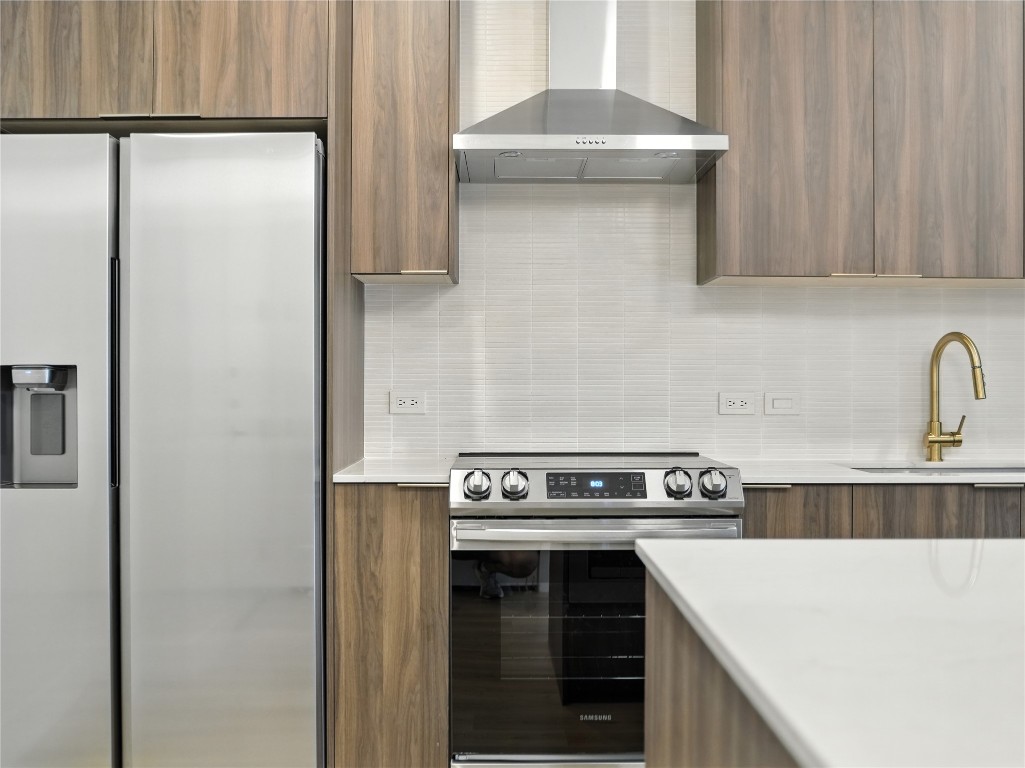 1701 Simond Avenue, Unit 302 Austin, TX 78723 - Photo 2 of 26 a kitchen with stainless steel appliances a refrigerator and a stove
