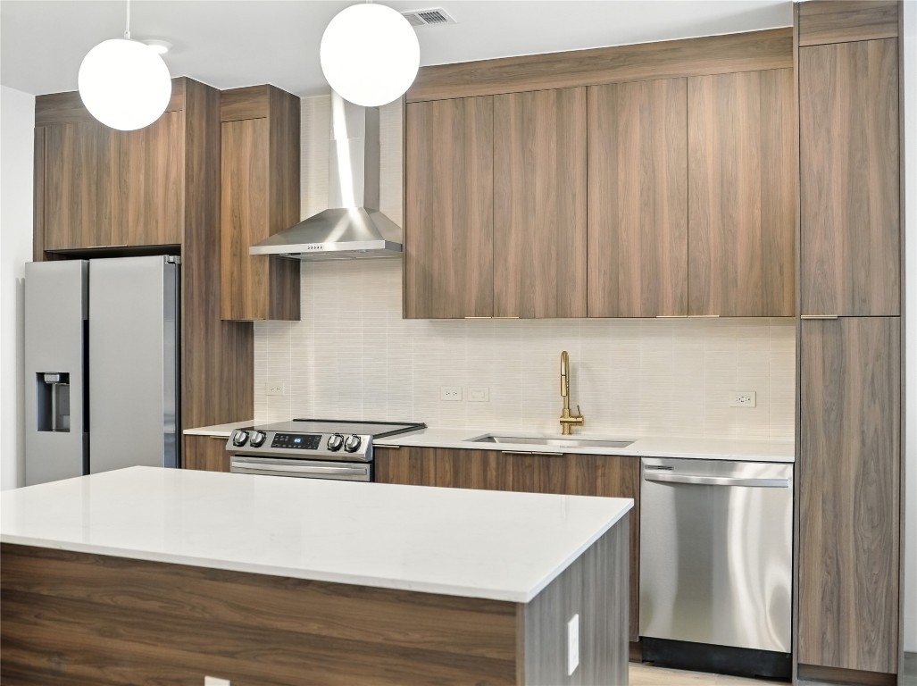 1701 Simond Avenue, Unit 302 Austin, TX 78723 - Photo 3 of 26 a kitchen with cabinets and a table