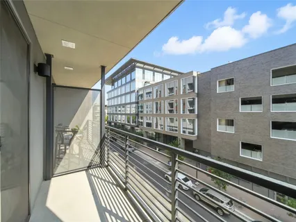 a kitchen with wooden cabinets and stainless steel appliances