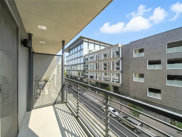 a kitchen with wooden cabinets and stainless steel appliances