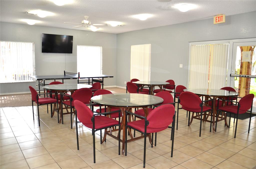 255 South Cypress Road, Unit 342 Pompano Beach, FL 33060 - Photo 15 of 23 a view of a dining room with furniture