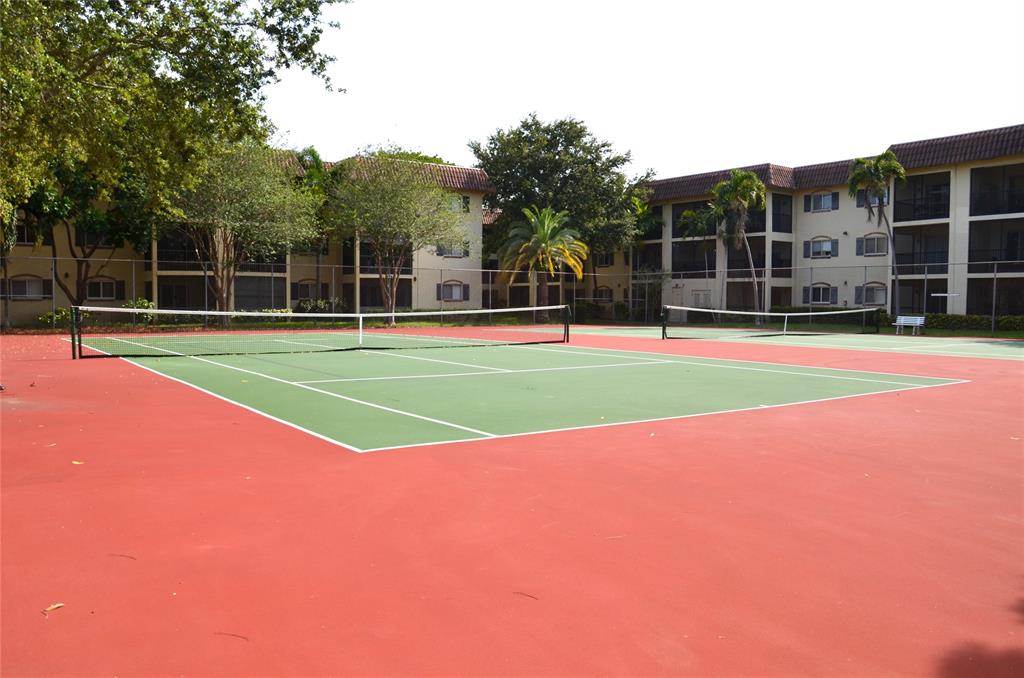 255 South Cypress Road, Unit 342 Pompano Beach, FL 33060 - Photo 18 of 23 a view of a tennis court