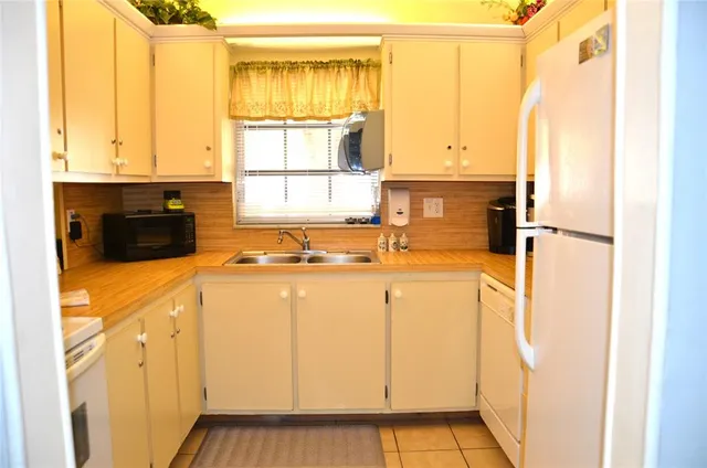 a bathroom with a sink a mirror and a shower