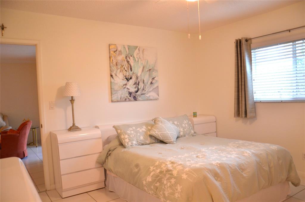 255 South Cypress Road, Unit 342 Pompano Beach, FL 33060 - Photo 9 of 23 a bedroom with a bed and a window