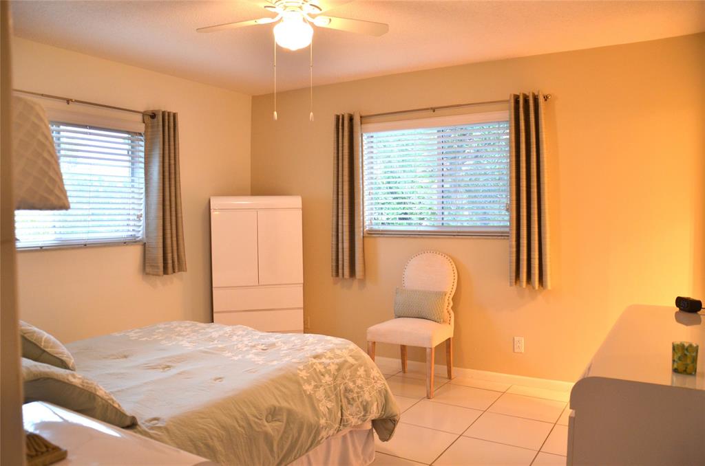 255 South Cypress Road, Unit 342 Pompano Beach, FL 33060 - Photo 10 of 23 a bedroom with a bed and a window