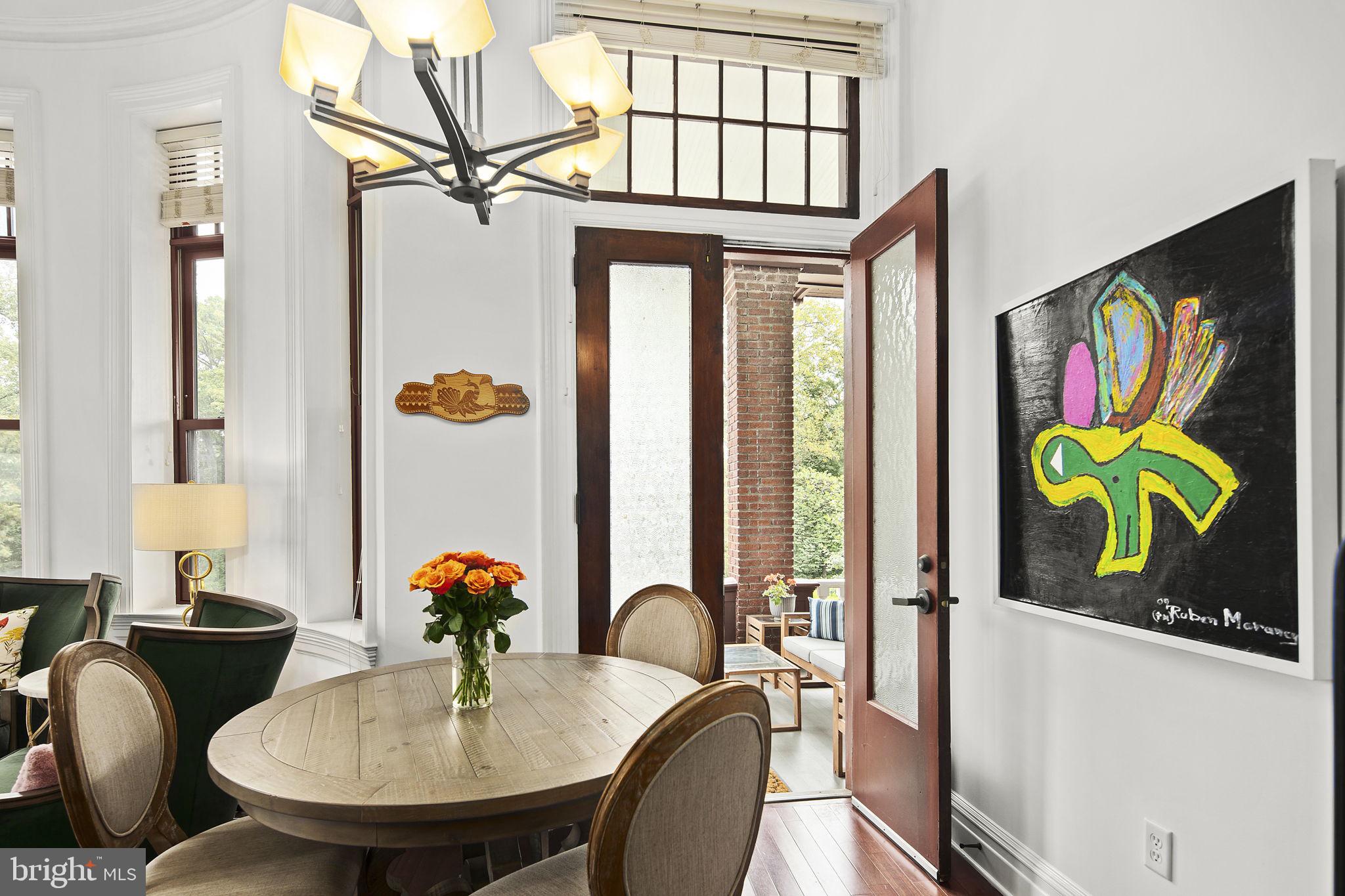 9610 Dewitt Drive, Unit PH204 Silver Spring, MD 20910 - Photo 12 of 42 a dining room with furniture and window