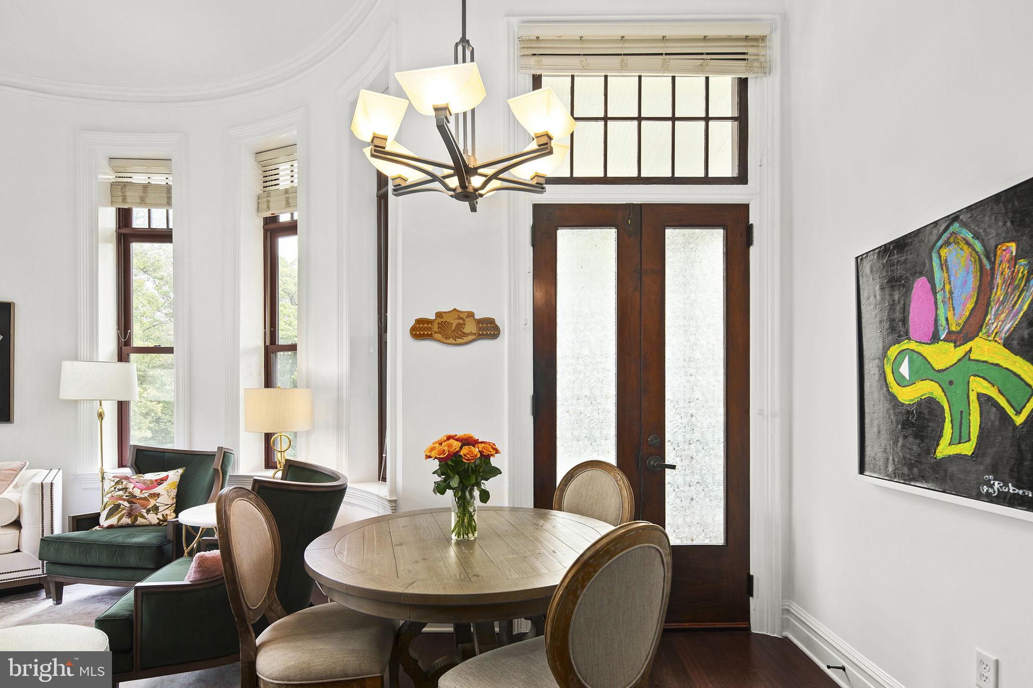 9610 Dewitt Drive, Unit PH204 Silver Spring, MD 20910 - Photo 13 of 42 a view of a dining room with furniture window and wooden floor