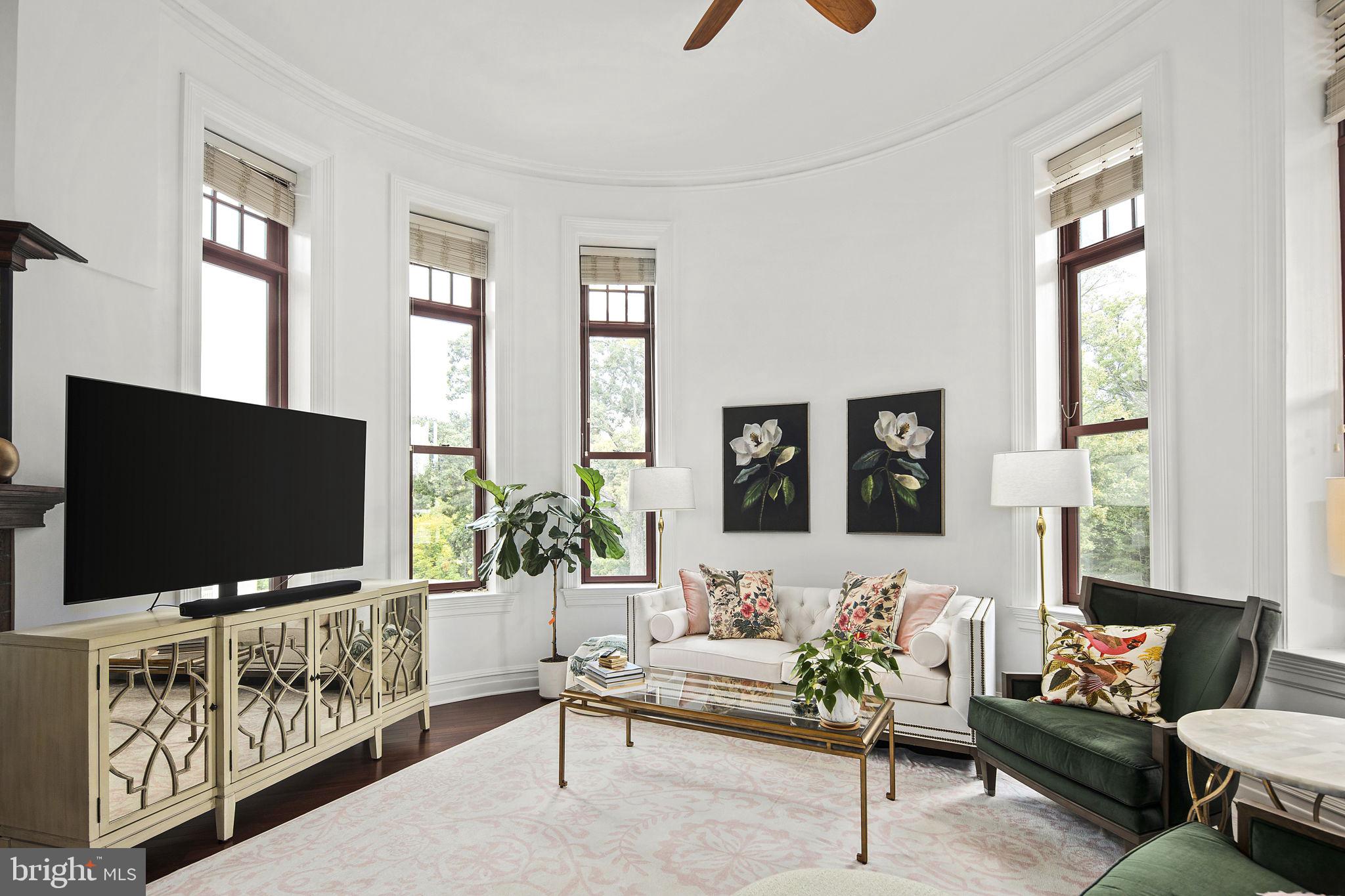 9610 Dewitt Drive, Unit PH204 Silver Spring, MD 20910 - Photo 16 of 42 a living room with furniture and a flat screen tv