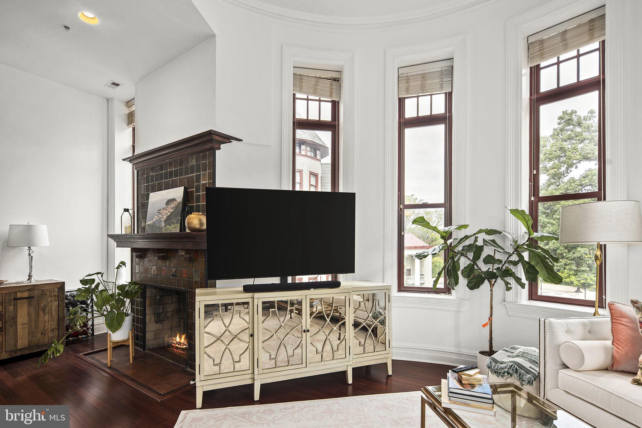 9610 Dewitt Drive, Unit PH204 Silver Spring, MD 20910 - Photo 18 of 42 a living room with furniture and a flat screen tv
