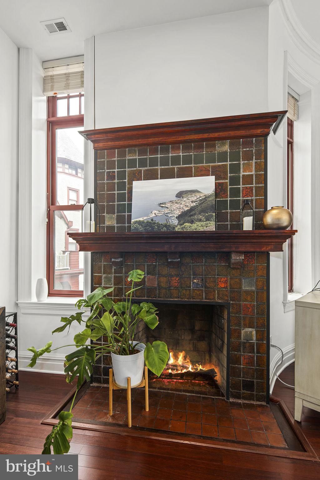 9610 Dewitt Drive, Unit PH204 Silver Spring, MD 20910 - Photo 19 of 42 a living room with furniture and a fireplace