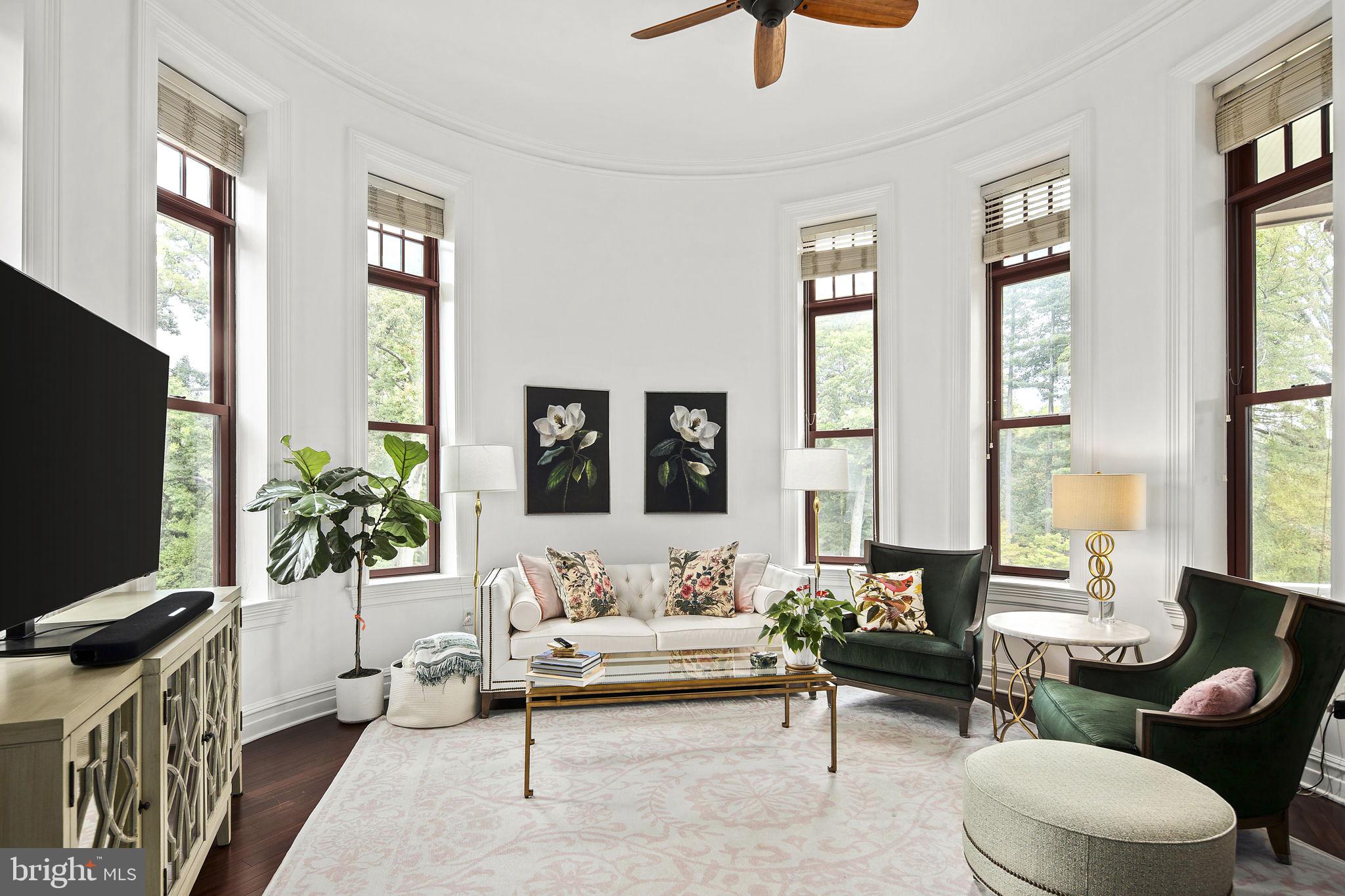 9610 Dewitt Drive, Unit PH204 Silver Spring, MD 20910 - Photo 2 of 42 a living room with furniture and a flat screen tv