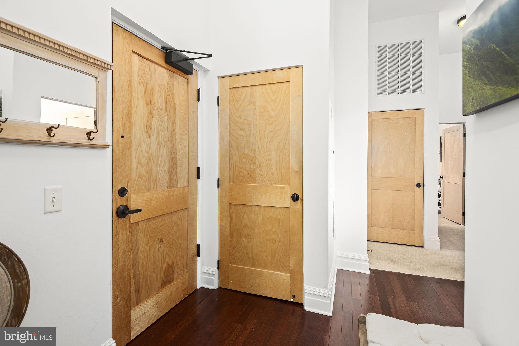 9610 Dewitt Drive, Unit PH204 Silver Spring, MD 20910 - Photo 27 of 42 a view of a bathroom with a shower and wooden floor