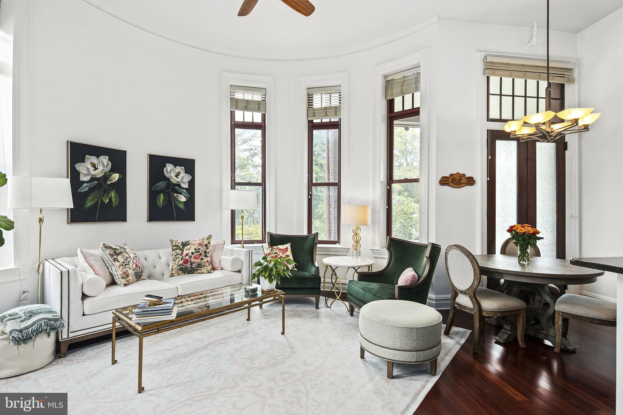 9610 Dewitt Drive, Unit PH204 Silver Spring, MD 20910 - Photo 3 of 42 a living room with furniture and a large window