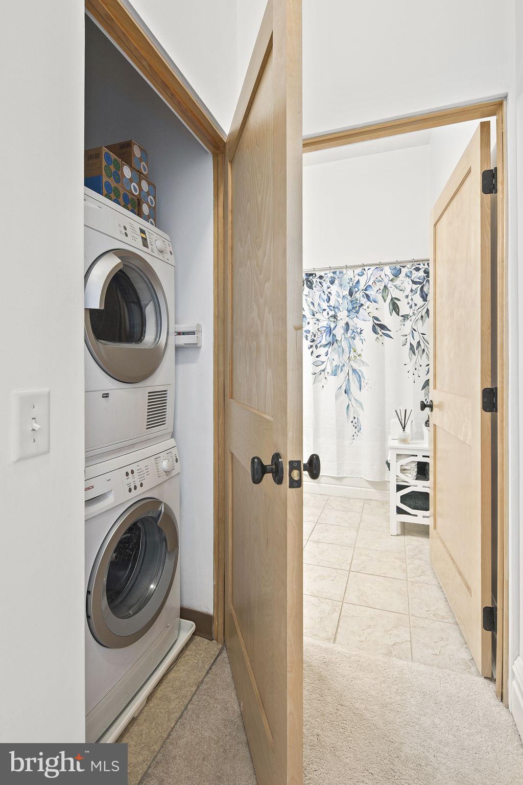 9610 Dewitt Drive, Unit PH204 Silver Spring, MD 20910 - Photo 32 of 42 a utility room with dryer and washer