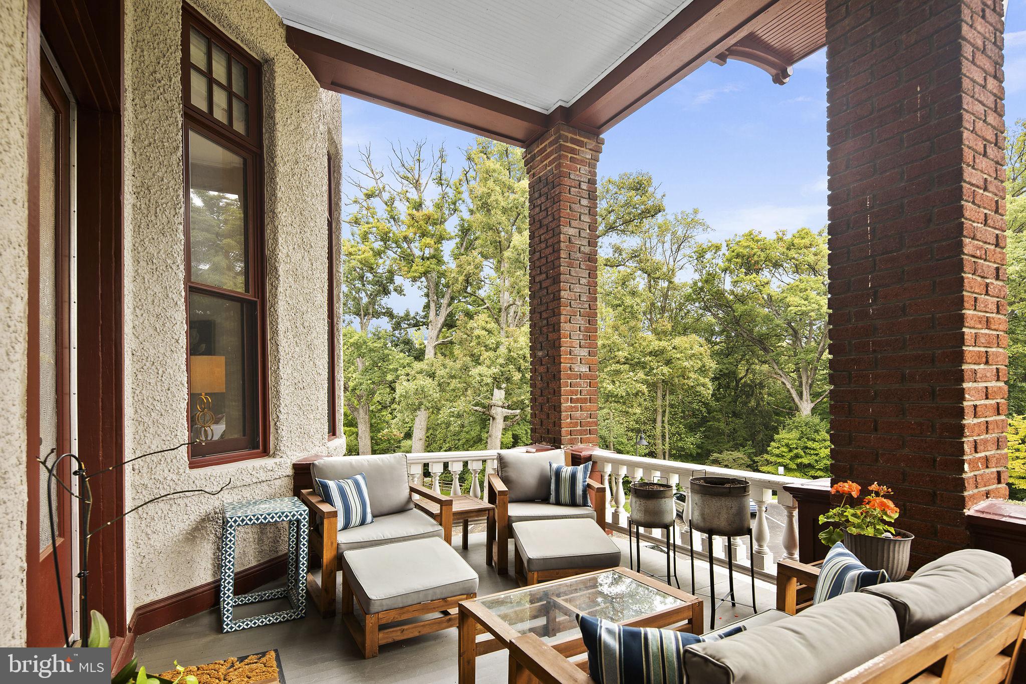9610 Dewitt Drive, Unit PH204 Silver Spring, MD 20910 - Photo 36 of 42 a balcony with furniture and a large window